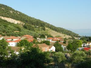 a small town on a hill with houses at Aspri Ammos House in Kavála