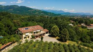 an aerial view of a house in a vineyard at Agriturismo Turina in Bricherasio