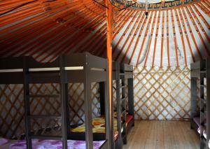 a room with two bunk beds in a yurt at Bakonyi Camping in Zirc