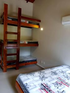 Cama o camas de una habitación en Condominio Fechado das Maritacas - Praia do Curral - Ilhabela - Sp