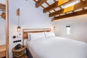 Posteľ alebo postele v izbe v ubytovaní Nao Catedral Boutique Hotel