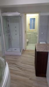 a bathroom with a shower and a toilet and a sink at Vera Vacanza in Sannicola
