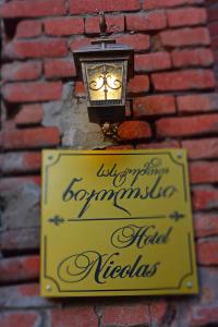 Certifikát, hodnocení, plakát nebo jiný dokument vystavený v ubytování Nicolas Boutique Hotel