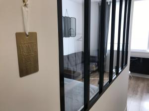 TV a/nebo společenská místnost v ubytování Au Studio 36 Arras avec parking privé