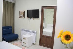 Postel nebo postele na pokoji v ubytování Nicolas Boutique Hotel