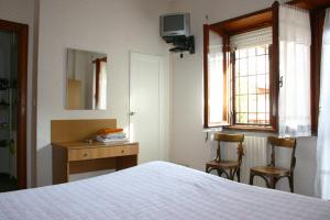 Postel nebo postele na pokoji v ubytování Albergo Anna