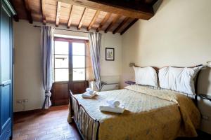 Säng eller sängar i ett rum på PanElios Borgo Vacanze