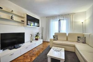 TV a/nebo společenská místnost v ubytování The Big Smile Apartments + 10 fotografií