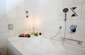 Ванная комната в Hotel Am Hirschhorn - Wellness - Spa - and more