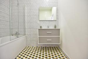 a bathroom with a sink and a mirror at TryLisbon Calvário in Lisbon +28 photos