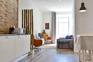 a living room with a table and chairs at TryLisbon Calvário in Lisbon