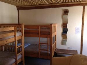 two bunk beds in a small room with at Pantyrathro International Hostel in Carmarthen