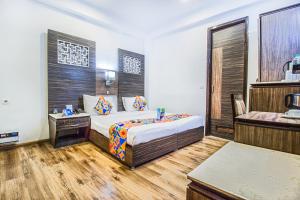 Кровать или кровати в номере Hotel Sunstar Heights