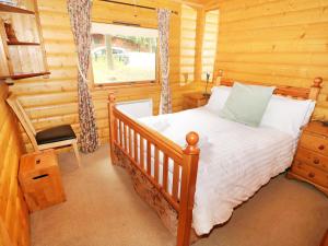 Tempat tidur dalam kamar di Lodge 8