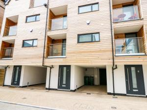 an apartment building with the front doors open at 7 Ocean Gateway in Hythe