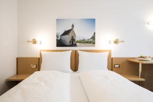 Posteľ alebo postele v izbe v ubytovaní Mondschein Rooms