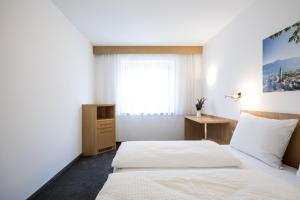 Posteľ alebo postele v izbe v ubytovaní Mondschein Rooms