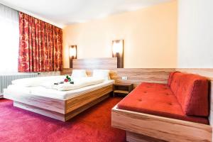 Posteľ alebo postele v izbe v ubytovaní Hotel Schladmingerhof