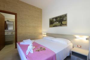 Postel nebo postele na pokoji v ubytování B&B Adriana