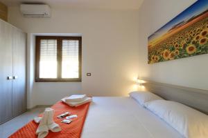 Postel nebo postele na pokoji v ubytování B&B Adriana