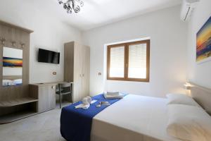 Postel nebo postele na pokoji v ubytování B&B Adriana