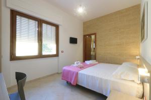 Postel nebo postele na pokoji v ubytování B&B Adriana