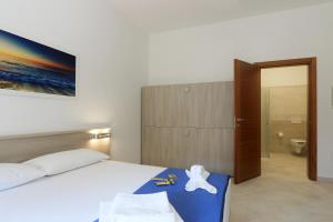 Postel nebo postele na pokoji v ubytování B&B Adriana