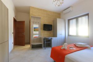 Postel nebo postele na pokoji v ubytování B&B Adriana