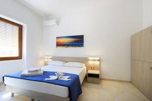 Postel nebo postele na pokoji v ubytování B&B Adriana