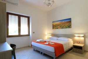 Postel nebo postele na pokoji v ubytování B&B Adriana