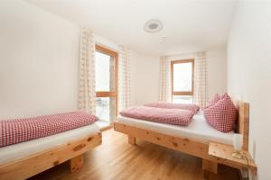 Ein Bett oder Betten in einem Zimmer der Unterkunft Martinshof