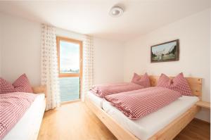 Ein Bett oder Betten in einem Zimmer der Unterkunft Martinshof
