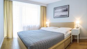 Postel nebo postele na pokoji v ubytování FARO Apartamenty Bliżej Morza