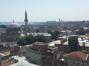 a view of a city with a mosque and buildings at Laleli Gonen Hotel in Istanbul