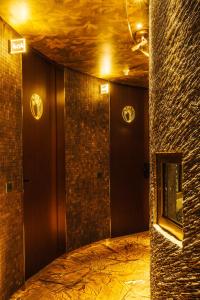 a room with a hallway with brick walls and lights at Hotel Bagués, a Small Luxury Hotel of the World in Barcelona