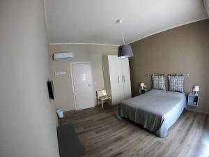 Postel nebo postele na pokoji v ubytování Stanza privata La Conquilla