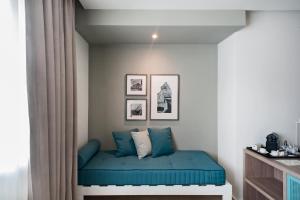A bed or beds in a room at Modica Beach Resort
