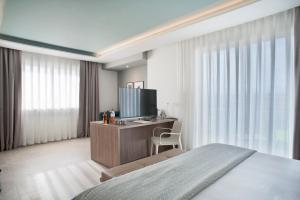 A television and/or entertainment centre at Modica Beach Resort