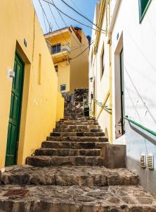 a set of stairs in an alley between buildings at Casa Mussa in Valle Gran Rey