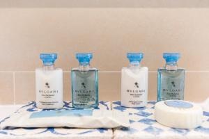 a group of four bottles of gin sitting on a counter at Palmares Beach House Hotel - Adults Only in Lagos