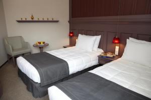 Postel nebo postele na pokoji v ubytování Rodopi Hotel