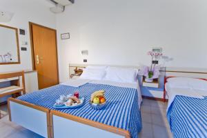 Postel nebo postele na pokoji v ubytování Hotel Montecarlo