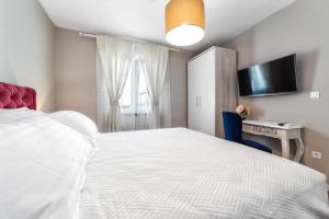 Кровать или кровати в номере Karmelita's place