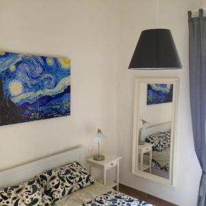 Posteľ alebo postele v izbe v ubytovaní La casetta dipinta