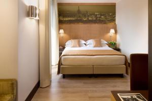 Postel nebo postele na pokoji v ubytování Starhotels Ritz