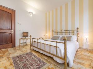 Łóżko lub łóżka w pokoju w obiekcie Villa Iole