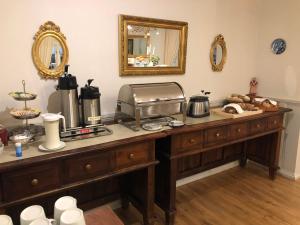 a kitchen with a counter top with a toaster oven and aounter at Guntorps Herrgård in Borgholm