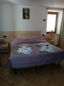 Postel nebo postele na pokoji v ubytování Affittacamere Chez Magan
