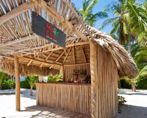 a wooden table topped with a sign for a beach resort at Catalonia Royal Bavaro - All Inclusive - Adults Only in Punta Cana