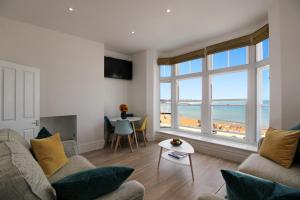 a living room with a view of the ocean at Macatsim Seaview Sunset in Margate